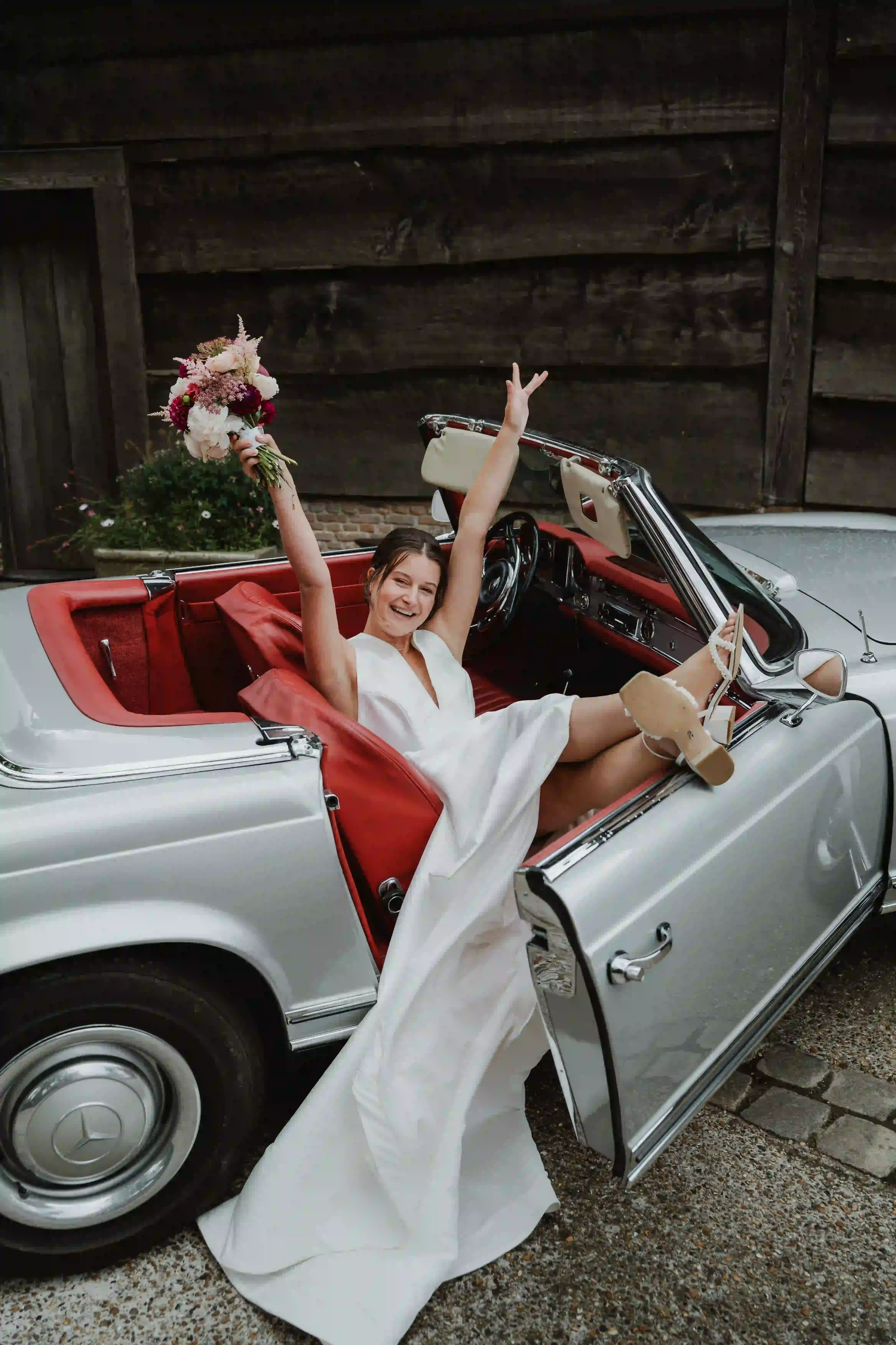 Wedding photography by Bert Van Den Eeckhaut — bride and groom in car