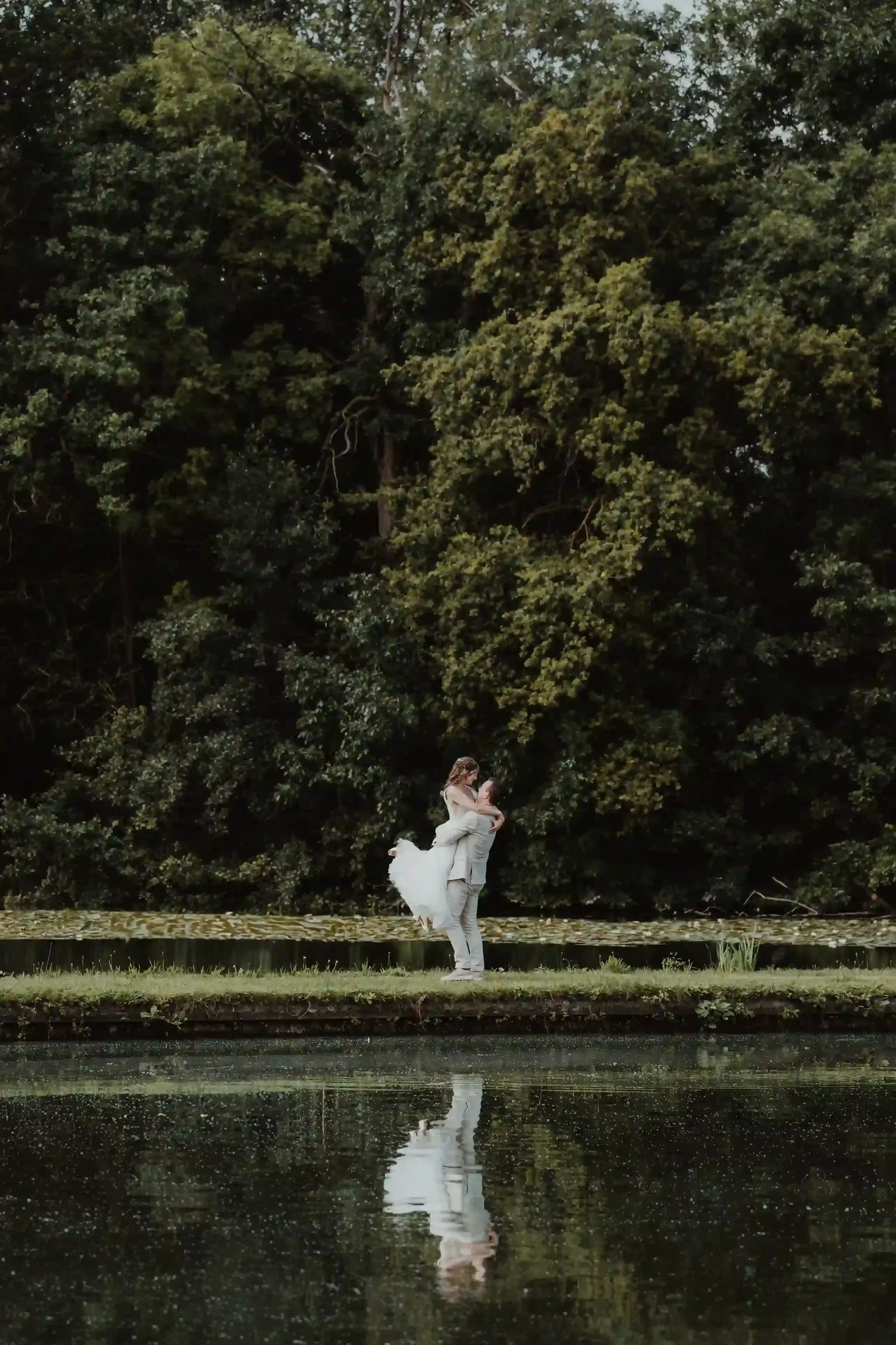 Wedding photography by Bert Van Den Eeckhaut — groom and bride posing for a photo