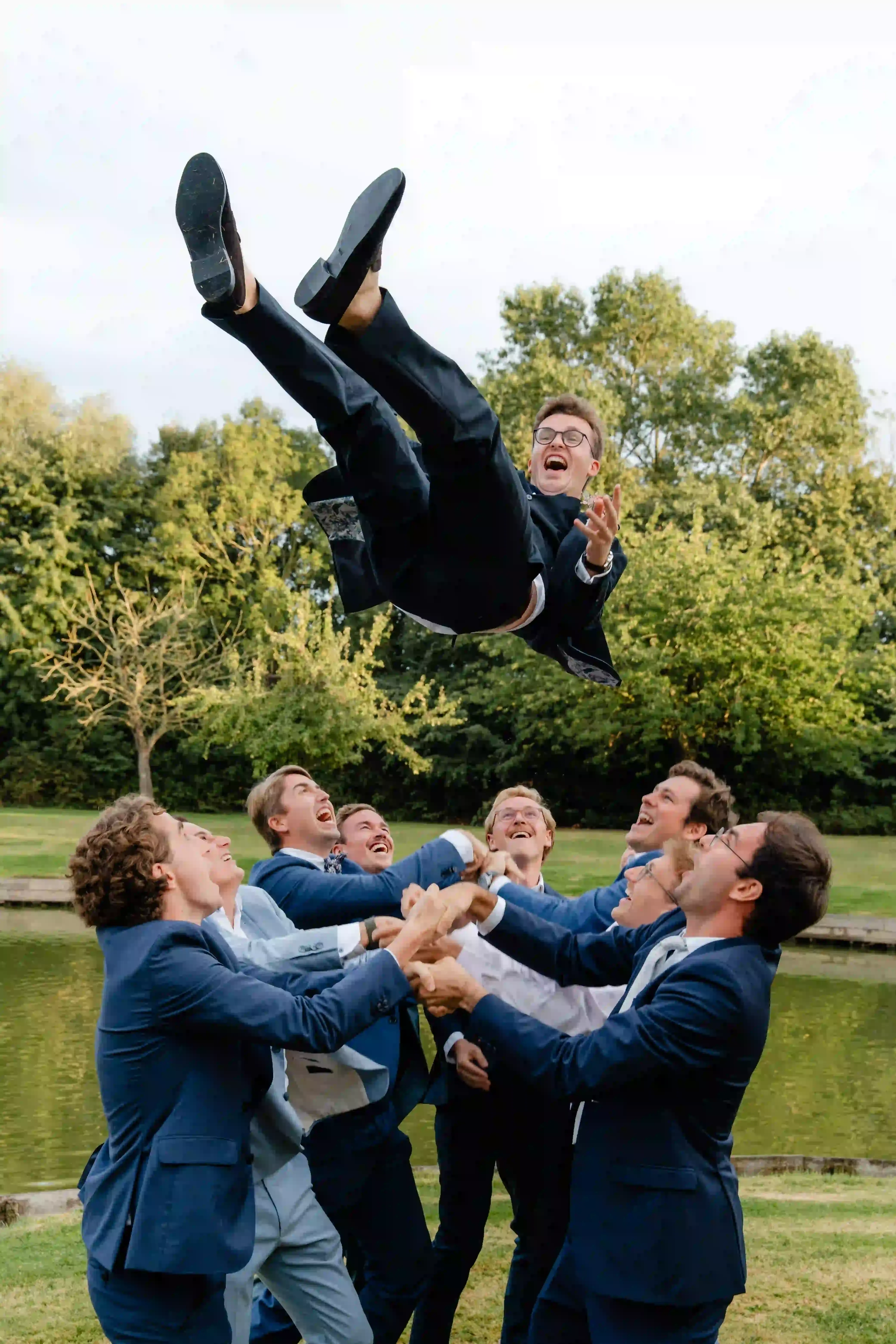Wedding photography by Bert Van Den Eeckhaut — man falling through air