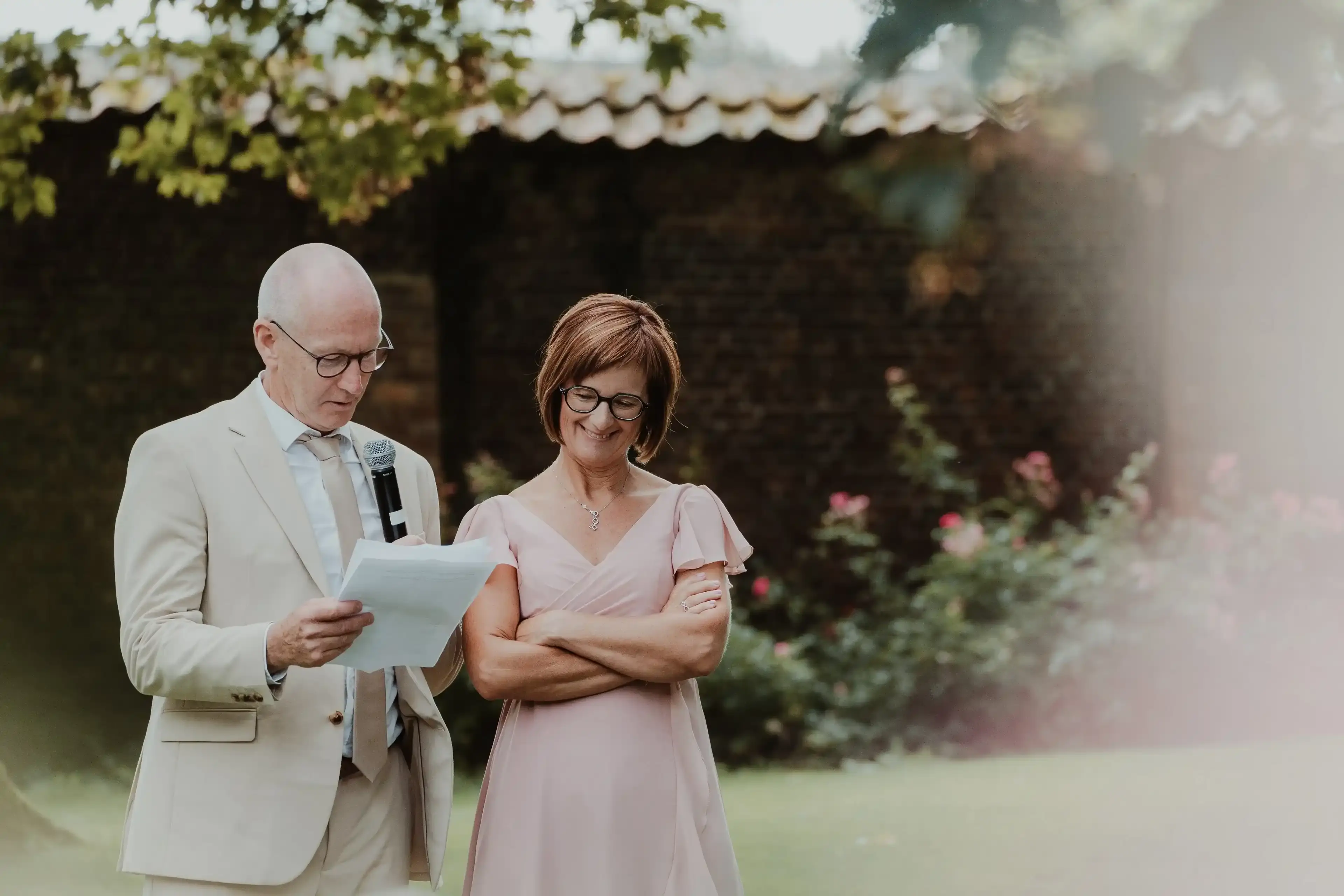 Wedding photography by Bert Van Den Eeckhaut — couple looking at paper
