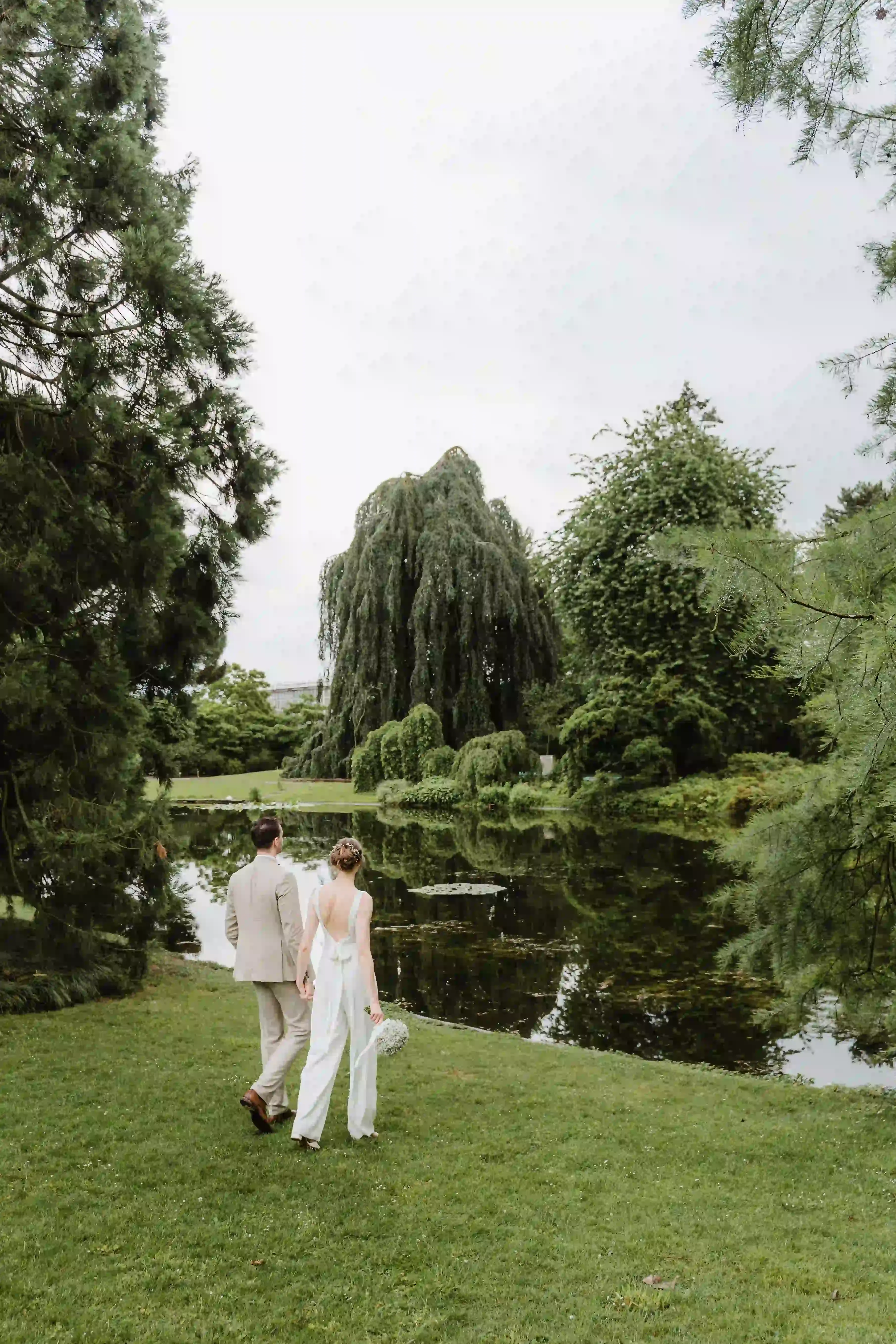 Wedding photography by Bert Van Den Eeckhaut — bride and groom near water