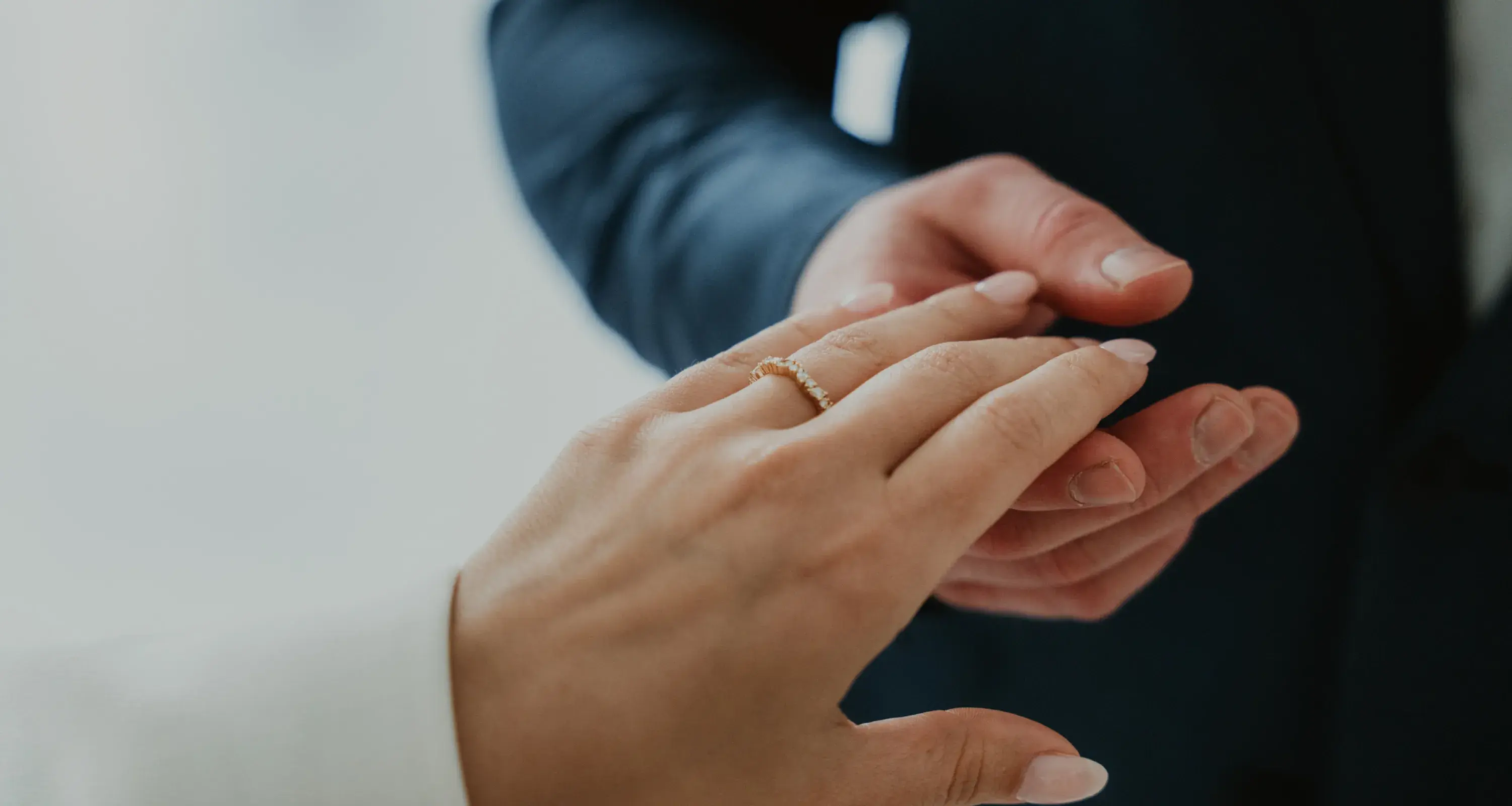 Wedding photography by Bert Van Den Eeckhaut — engaged couple holding hands and ring
