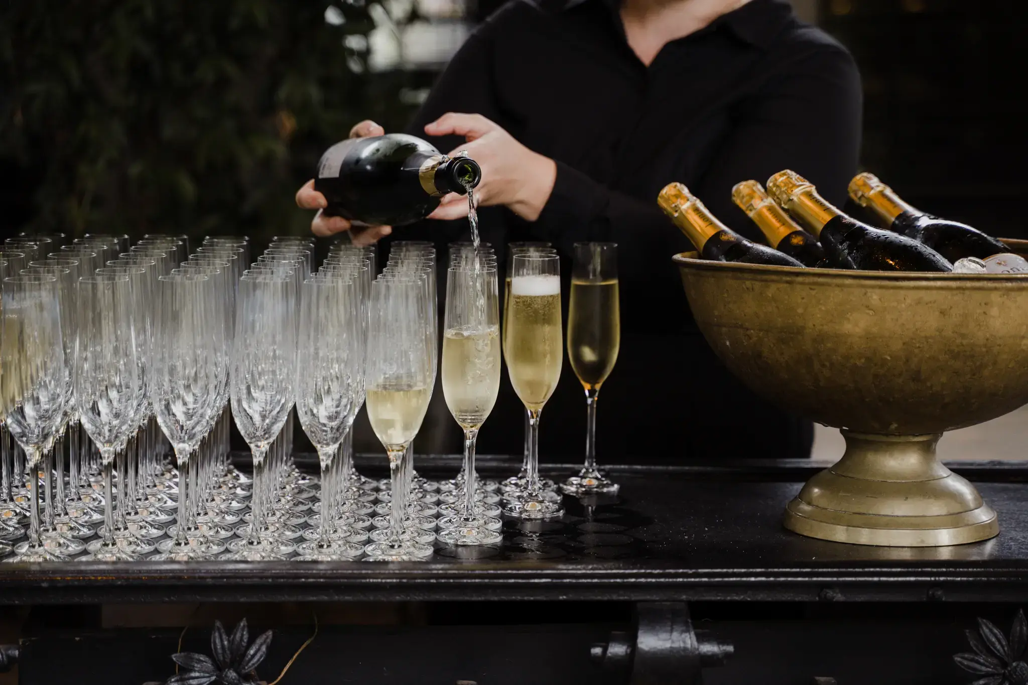 Wedding photography by Bert Van Den Eeckhaut — table of champagne bottles and glasses