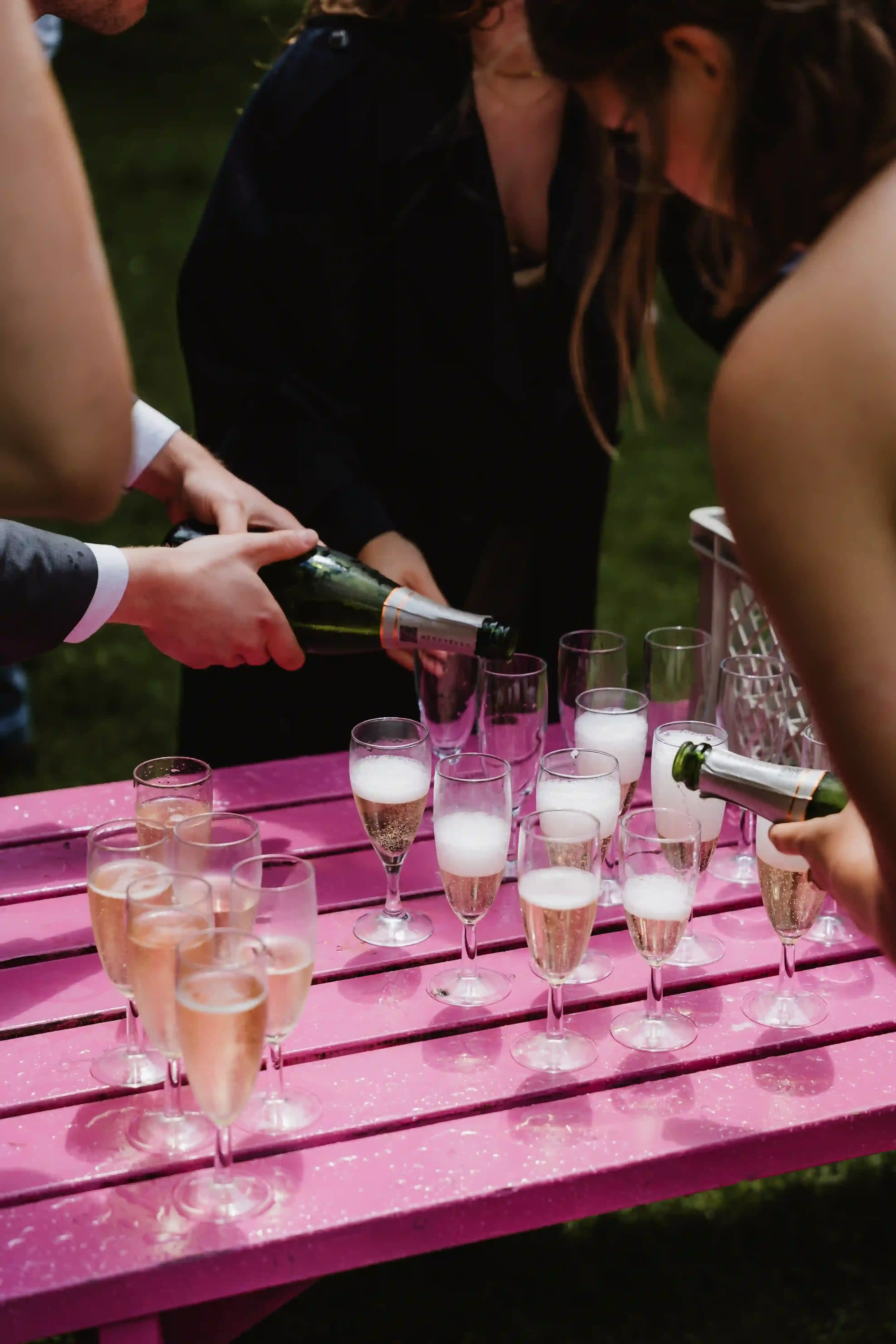 Wedding photography by Bert Van Den Eeckhaut — wedding party celebrates with champagne and cake