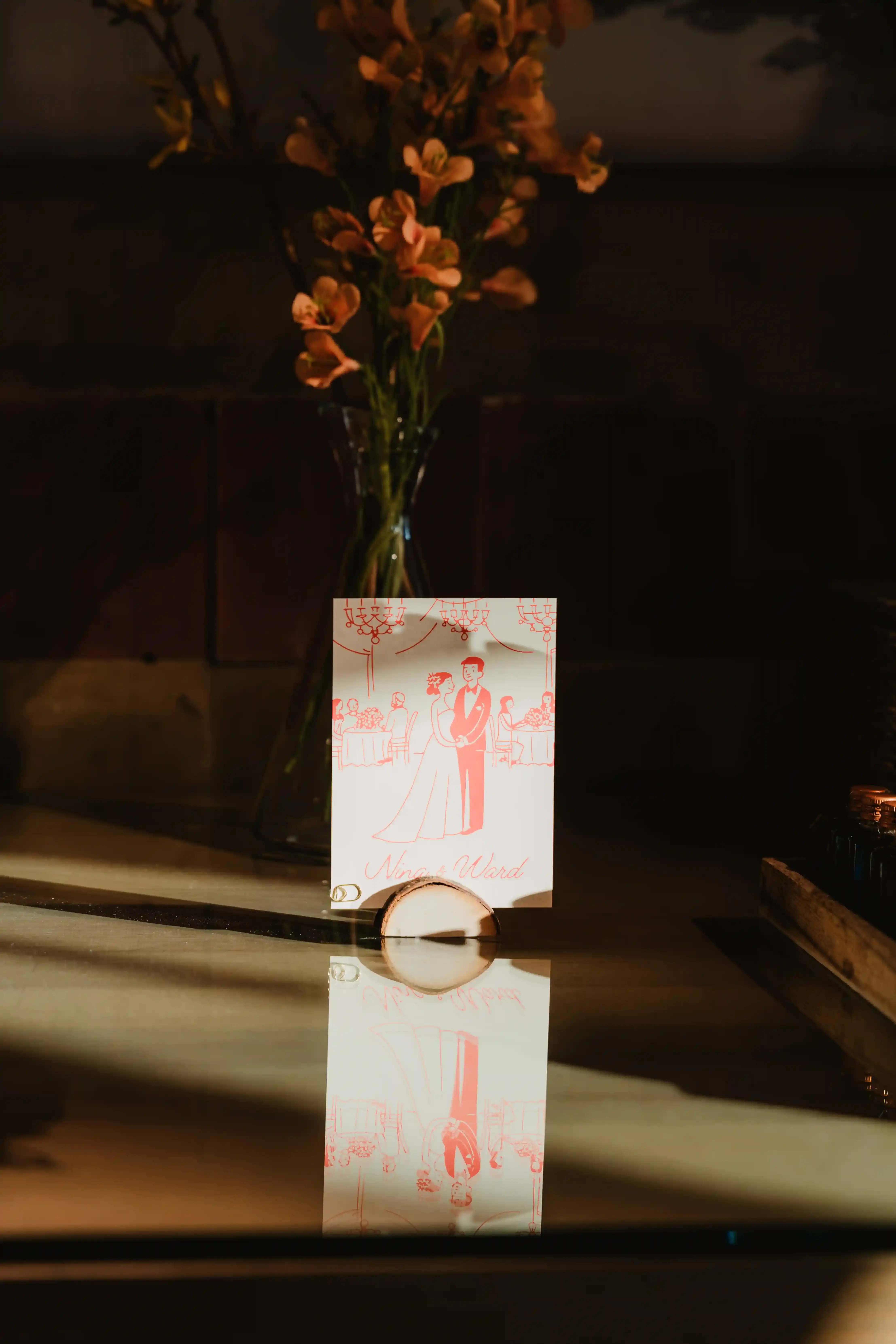 Wedding photography by Bert Van Den Eeckhaut — reflection of bride and groom on glass