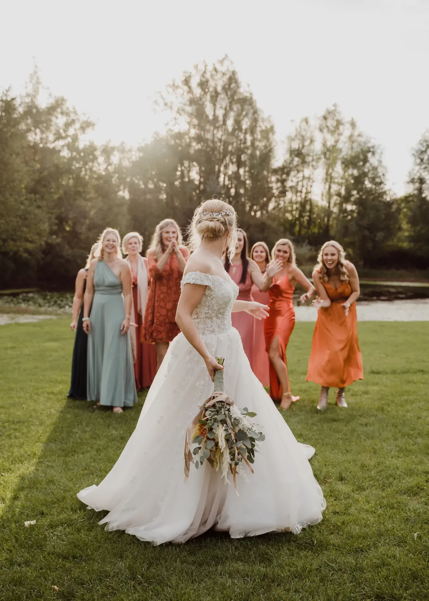 Wedding photography by Bert Van Den Eeckhaut — bride and bridesmaids in garden