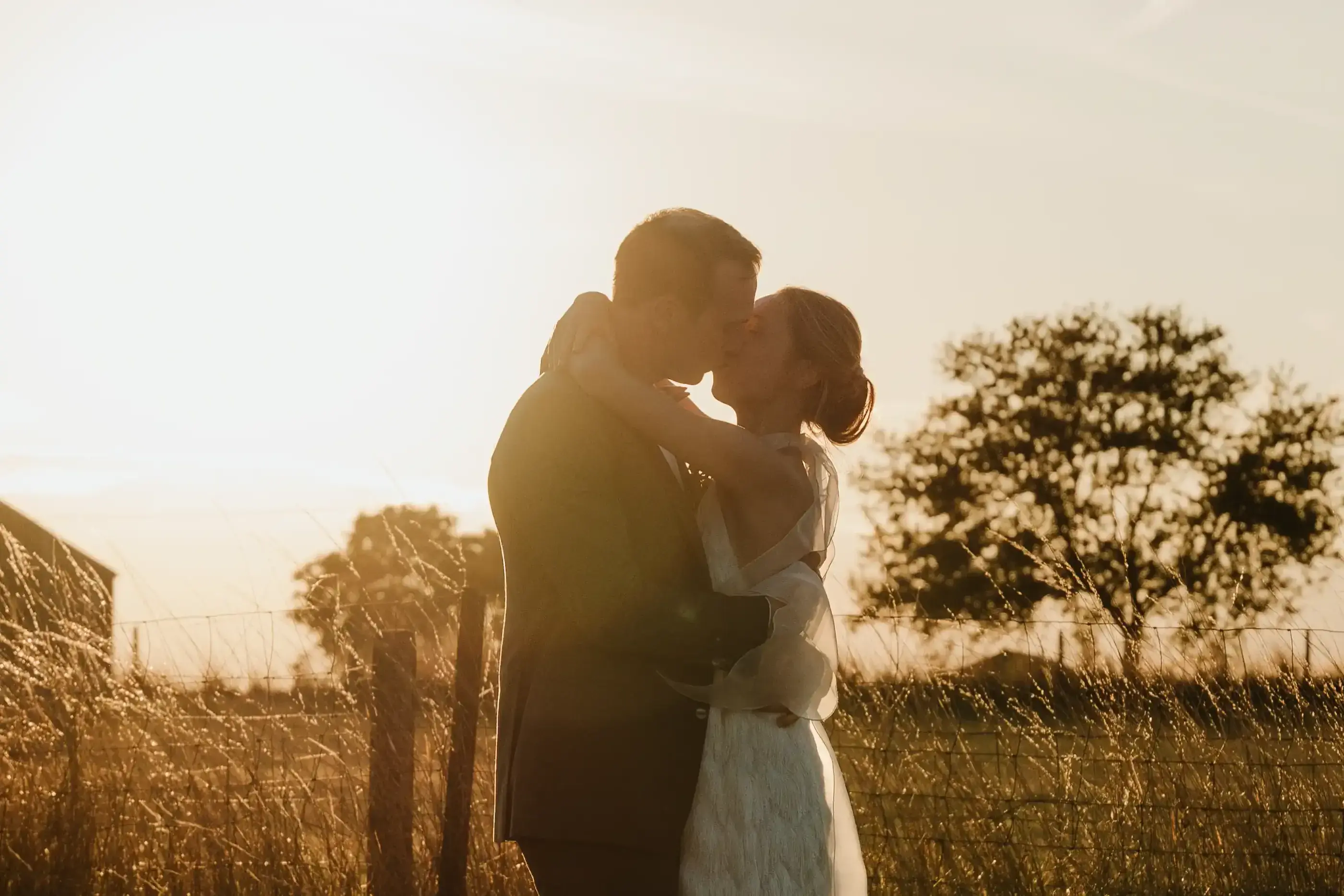 Wedding photography by Bert Van Den Eeckhaut — romantic sunset kiss