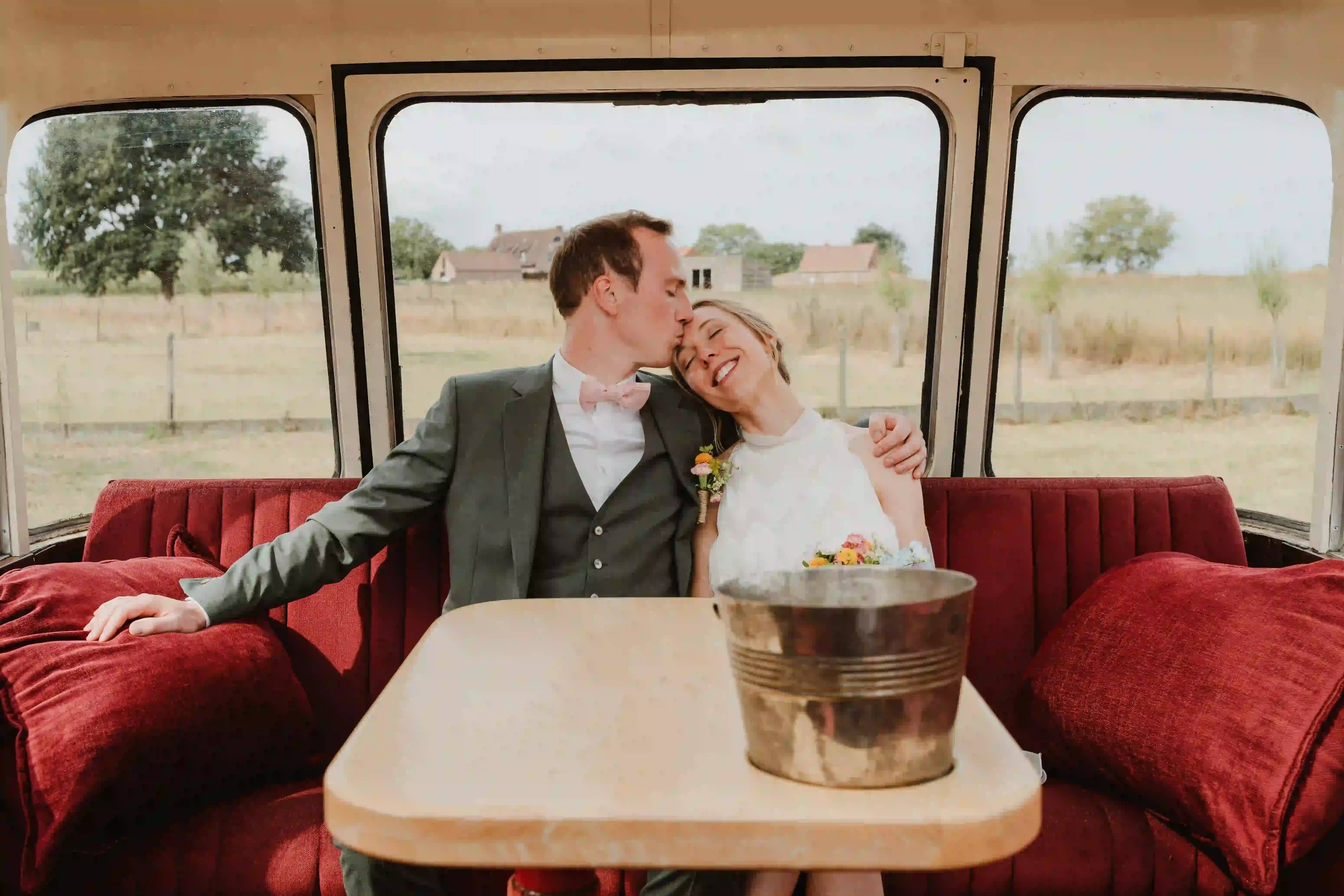 Wedding photography by Bert Van Den Eeckhaut — newlyweds, bus