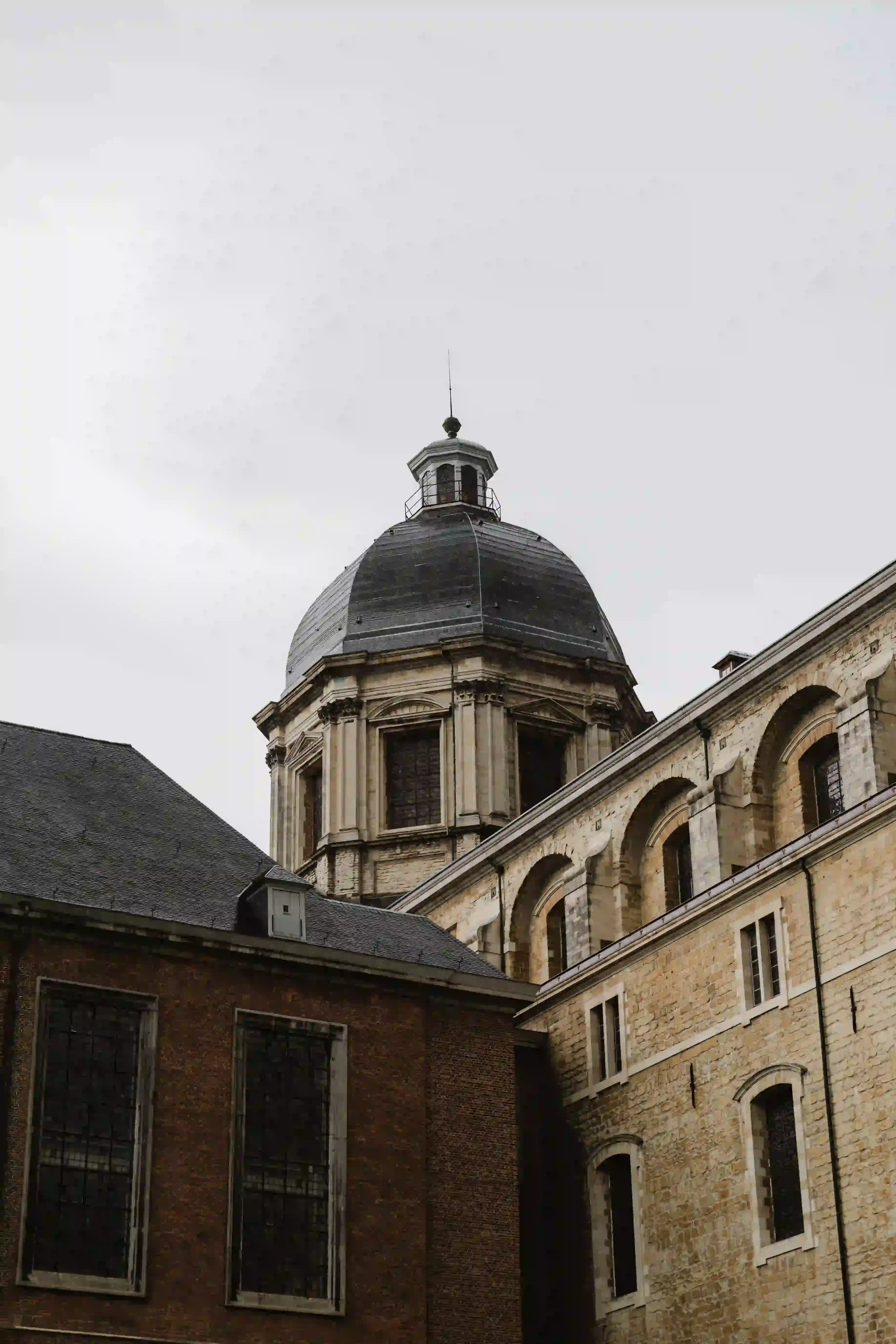 Wedding photography by Bert Van Den Eeckhaut — cathedral church tower against a cloudy sky