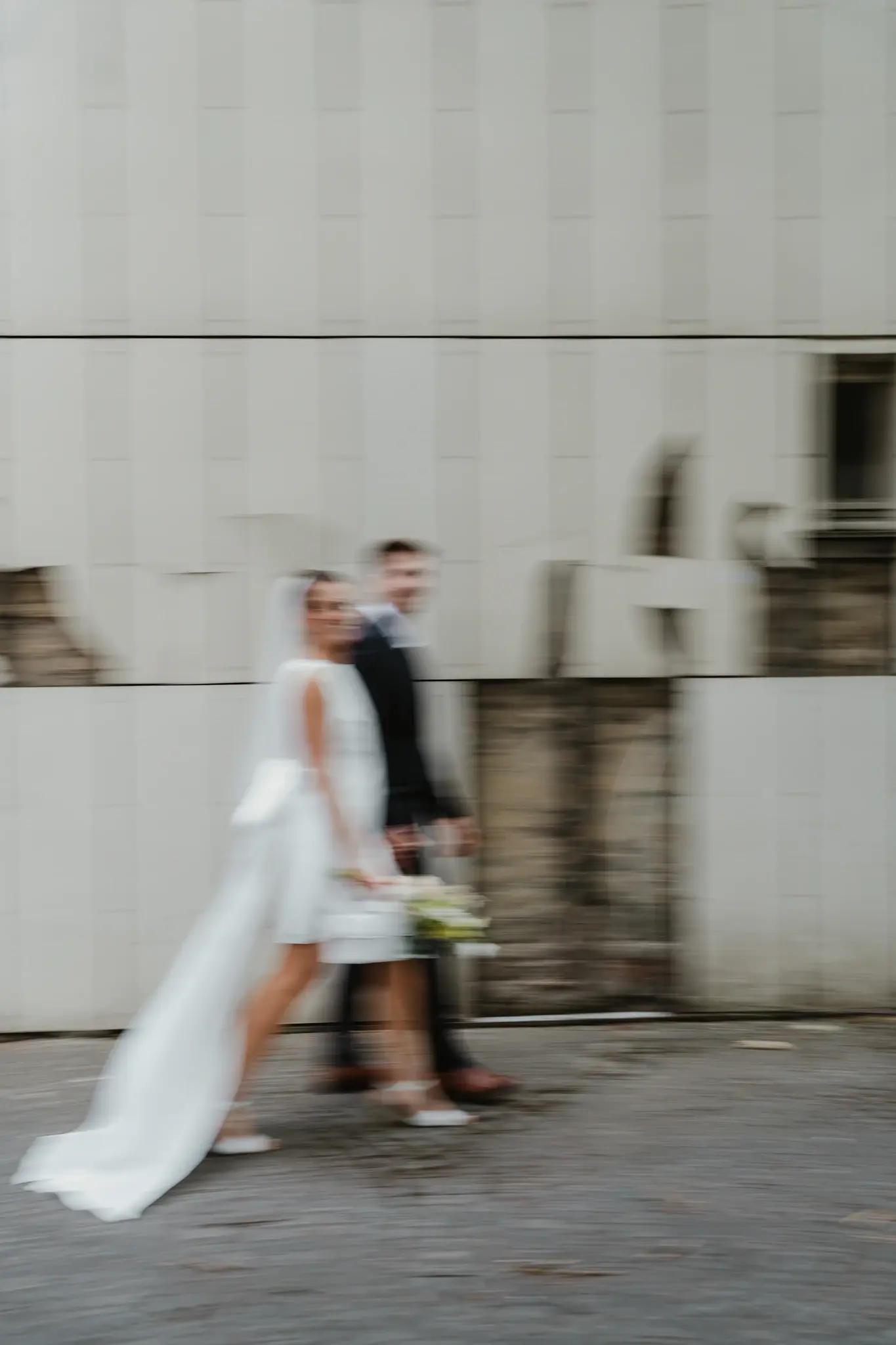 Wedding photography by Bert Van Den Eeckhaut — newlyweds walk away after getting married