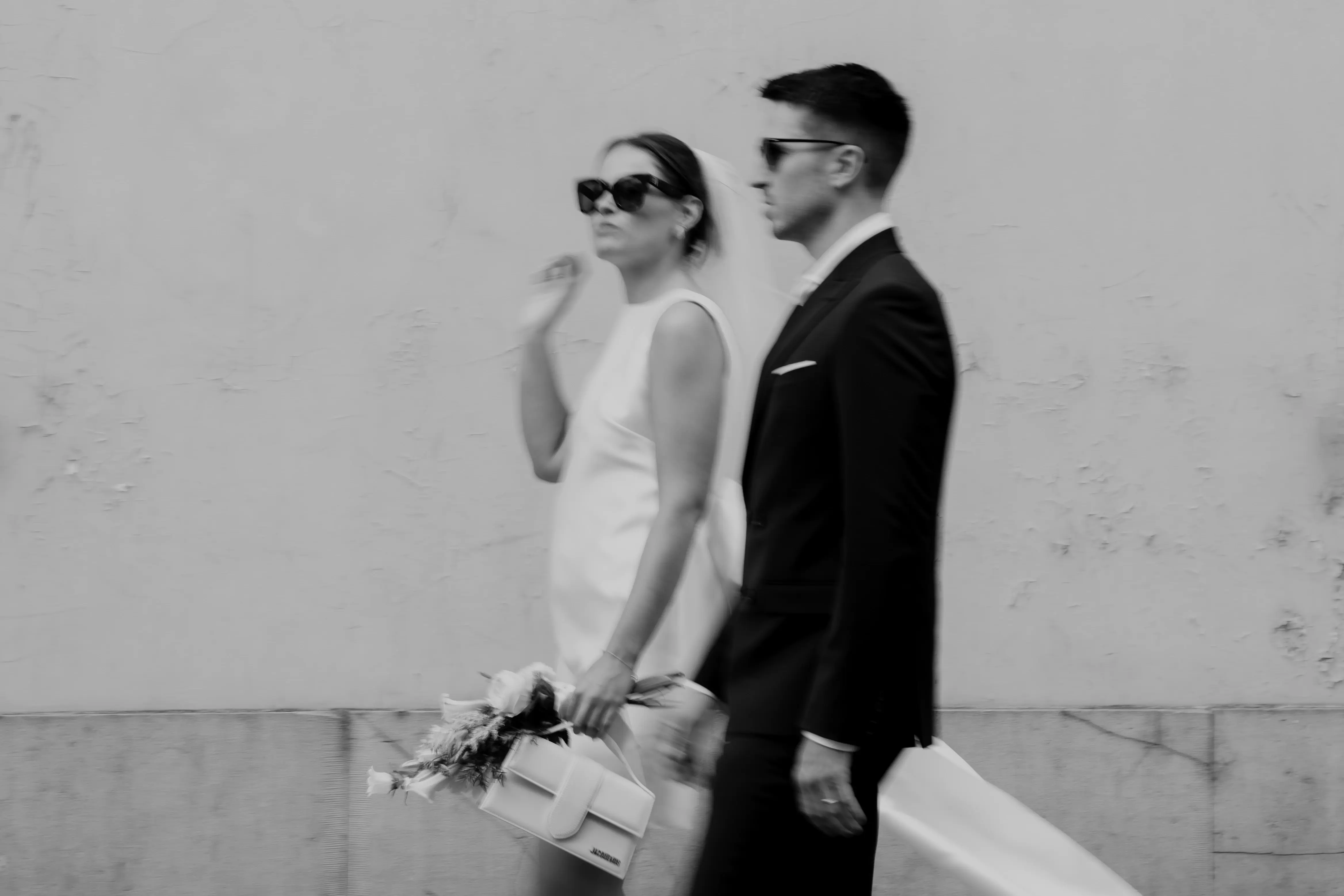 Wedding photography by Bert Van Den Eeckhaut — couple walking down street